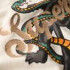 Camiseta holgada con rotulado tipo tatuaje
