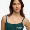 Camiseta sin mangas con botones bordados de Athletic Essentials