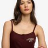Camiseta sin mangas con botones bordados de Athletic Essentials