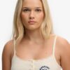 Camiseta sin mangas con botones bordados de Athletic Essentials