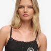 Camiseta sin mangas con botones bordados de Athletic Essentials