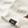 Chaleco con strass de tatuajes