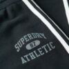 Pantalones jogger acampanados con rayas de Athletic Essentials