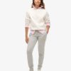 Pantalones jogger ajustados con logotipo metálico de lujo