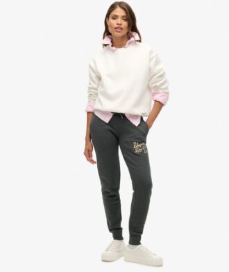 Pantalones jogger ajustados con logotipo metálico de lujo