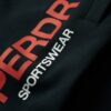 Pantalones jogger cónicos con logotipo deportivo