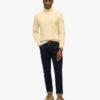 The Merchant Store – Jersey de cuello alto con trenzado