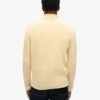 The Merchant Store – Jersey de cuello alto con trenzado